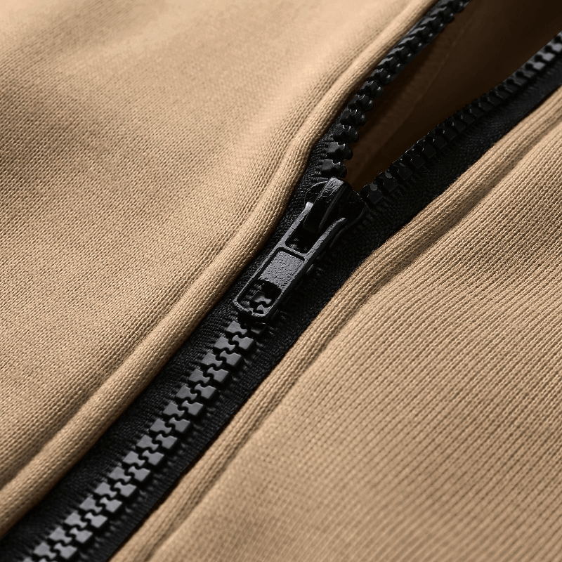 Close-up of stylish loose zipper on women's oversized hoodie, SF0086, showing durable synthetic fiber blend in camel color.
